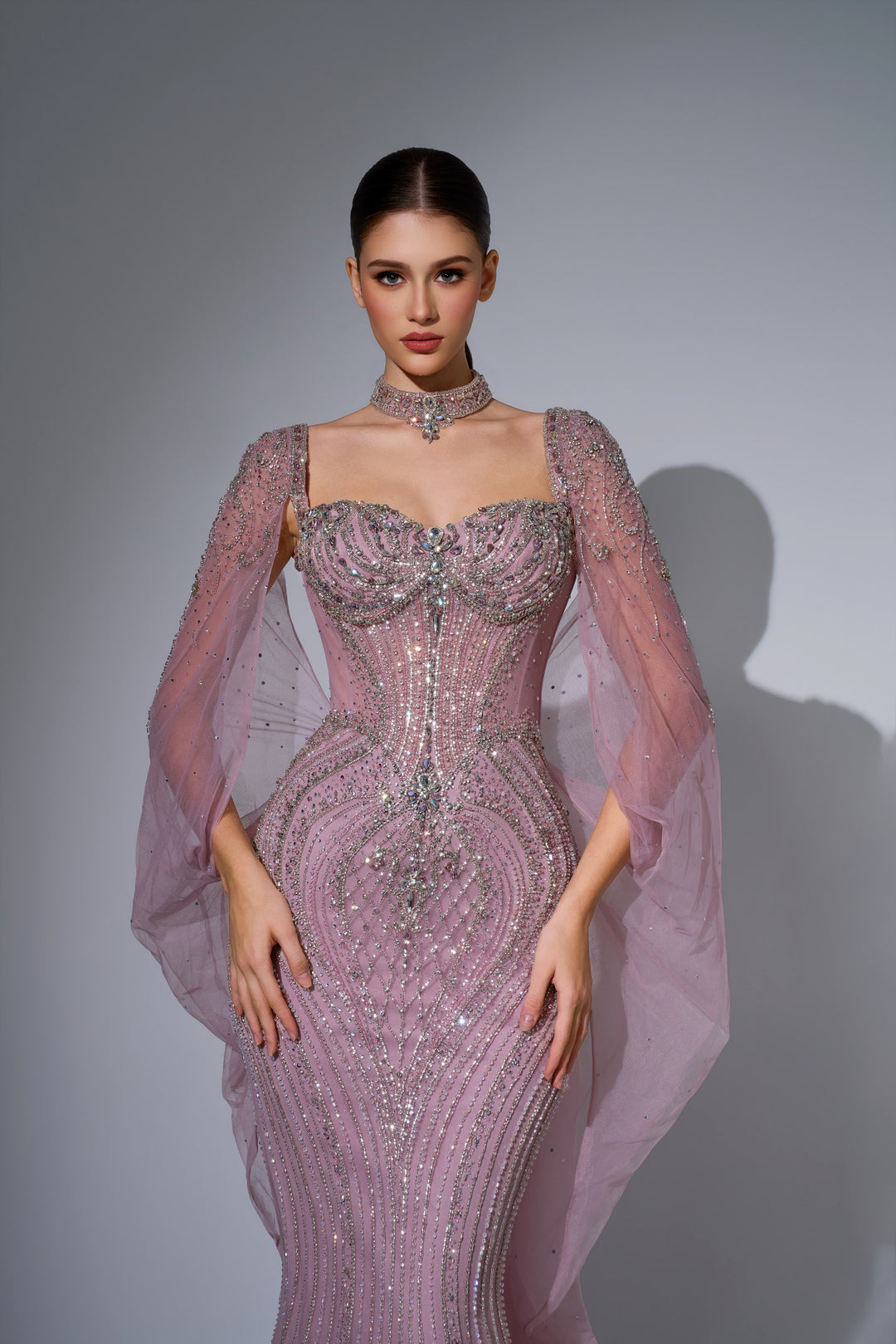 Delilah LD12076 Crystal Corset Mermaid Gown with Choker and Floor-Length Cape Sleeves - Pink close-up view