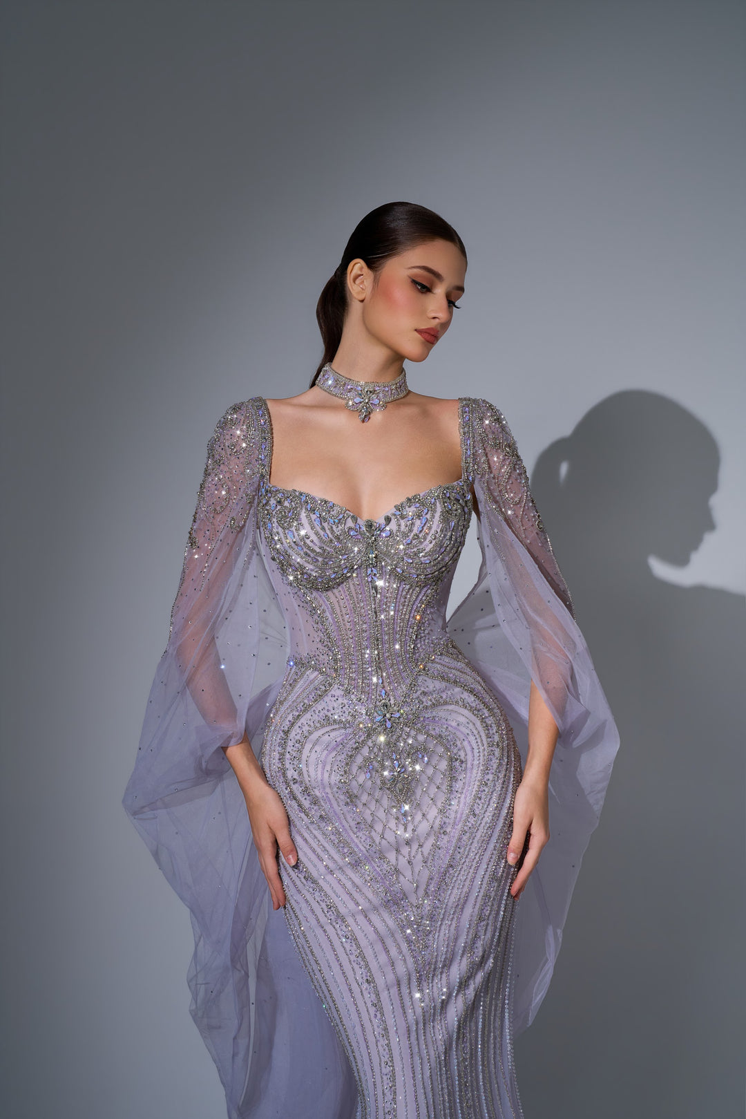 Delilah LD12076 Crystal Corset Mermaid Gown with Choker and Floor-Length Cape Sleeves - Purple close-up view