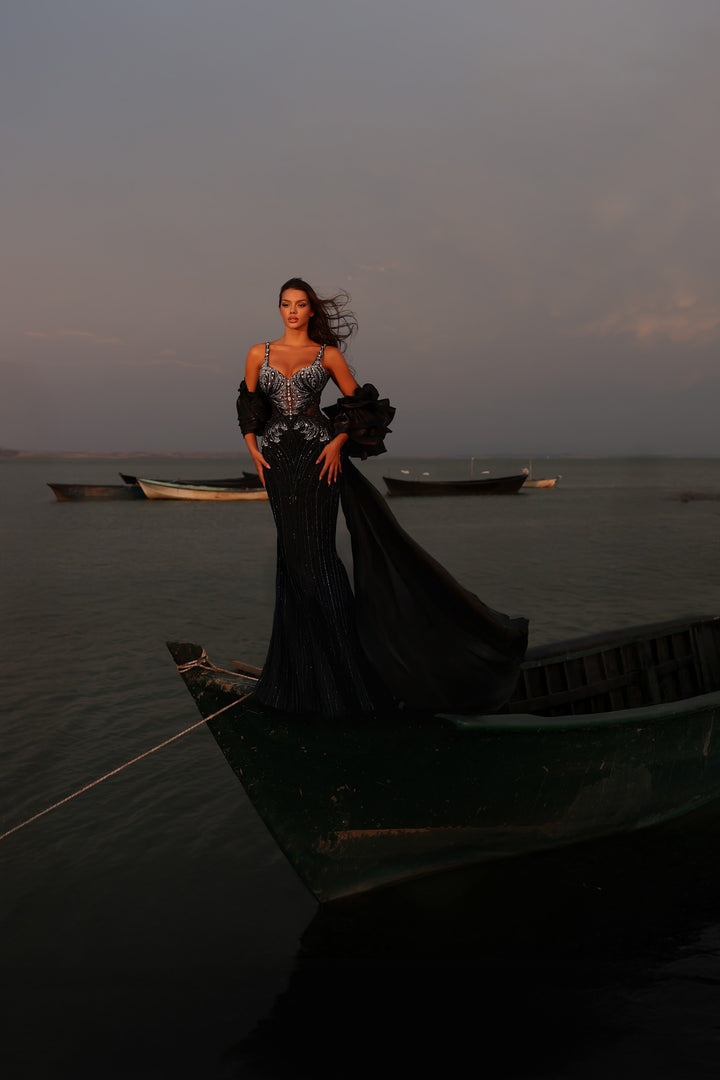 Delilah LD11585 Spaghetti Strap Crystal Corset Mermaid Gown with Ruffle Sleeves and Overskirt - Black front view