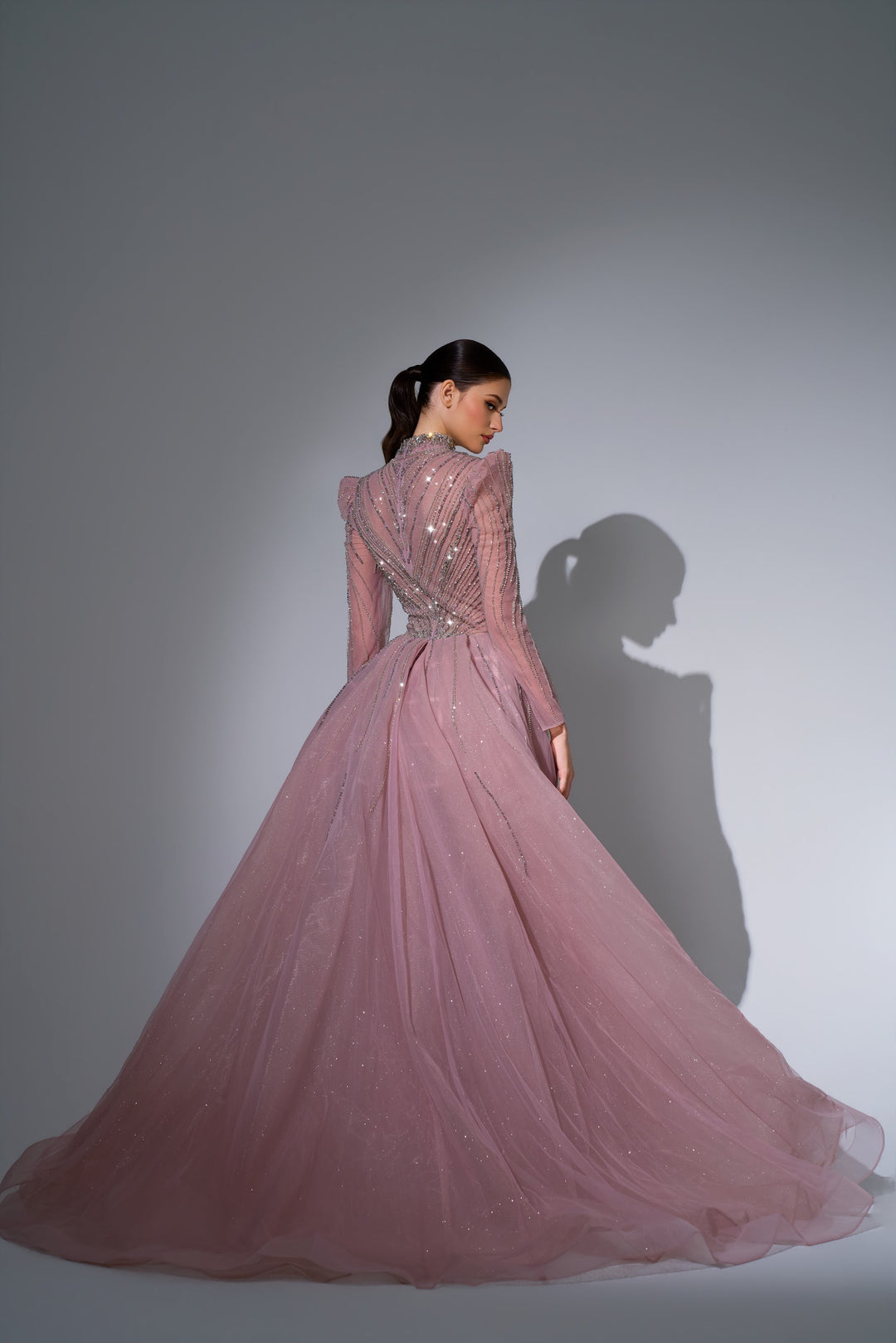 Delilah LD11650 High Collar Long Sleeve Crystal Sheath Gown with Tulle Overskirt - Pink back view