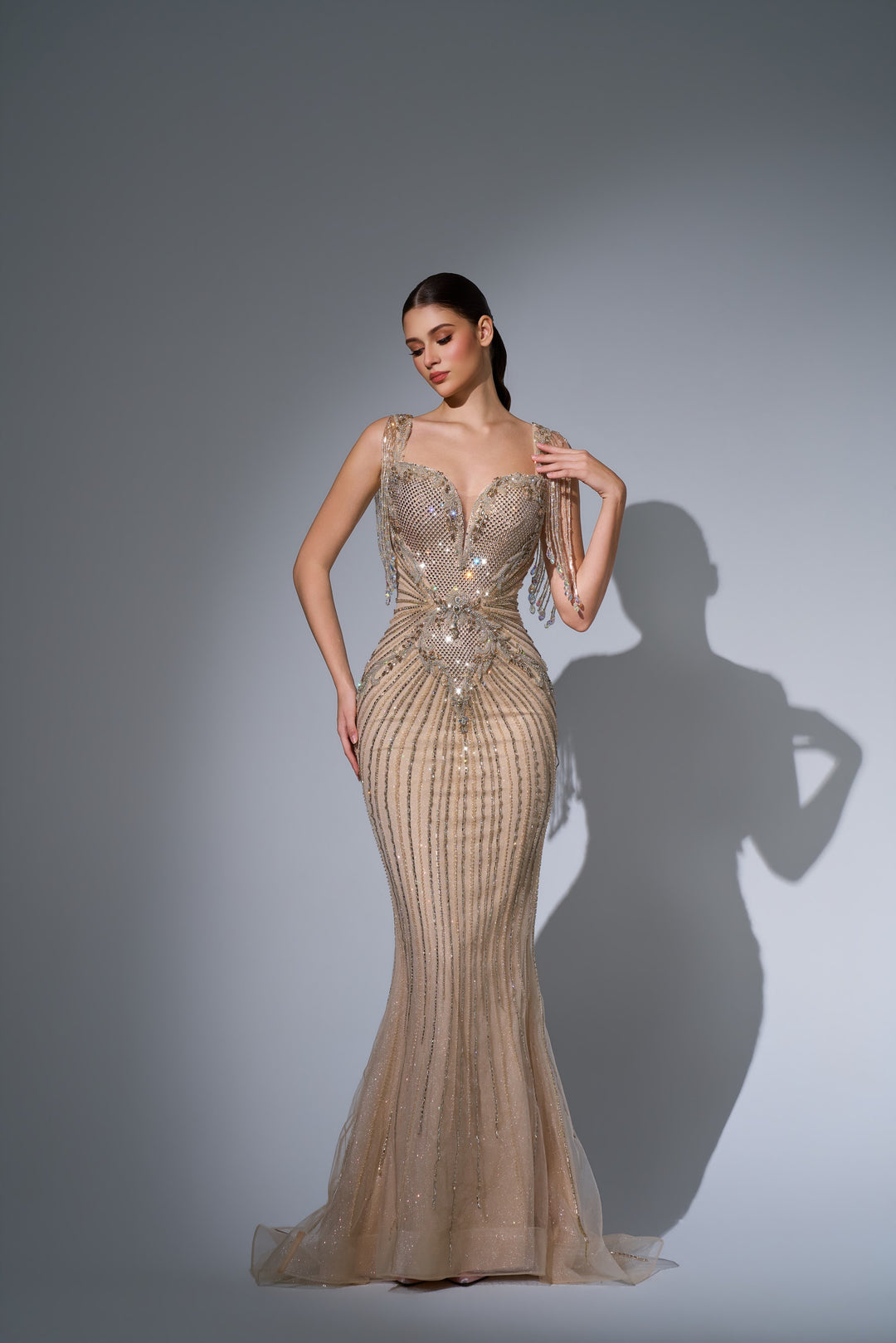 Delilah LD11684 Crystal Fringe Strap Plunging Linear Beaded Mermaid Gown - Champagne front view