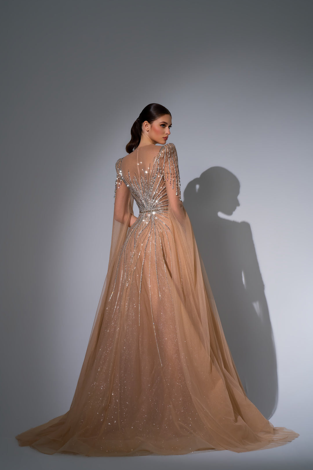Delilah LD11670 Illusion Neck Long Sleeve Cape Beaded A-Line Gown - Champagne back view