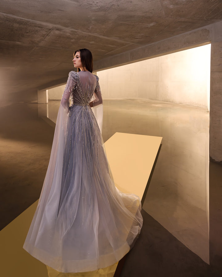 Delilah LD11670 Illusion Neck Long Sleeve Cape Beaded A-Line Gown - G.Blue back view