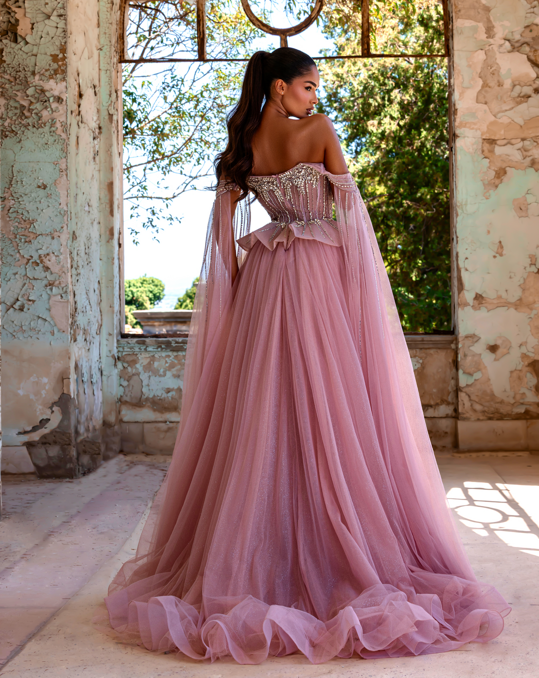 Delilah LD11214 Plunging Sweetheart Beaded Corset Mermaid Gown with Cape Sleeves and Overskirt - Pink back view